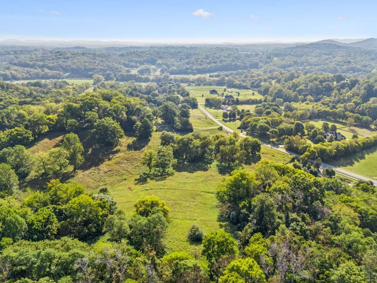 Enjoy breathtakingly high views of the rolling Tennessee hills on this picturesque 5-acre private estate