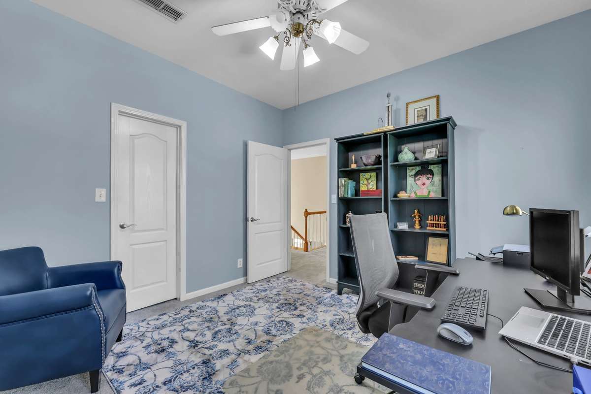Another view of bedroom 3 which also includes a walk in closet
