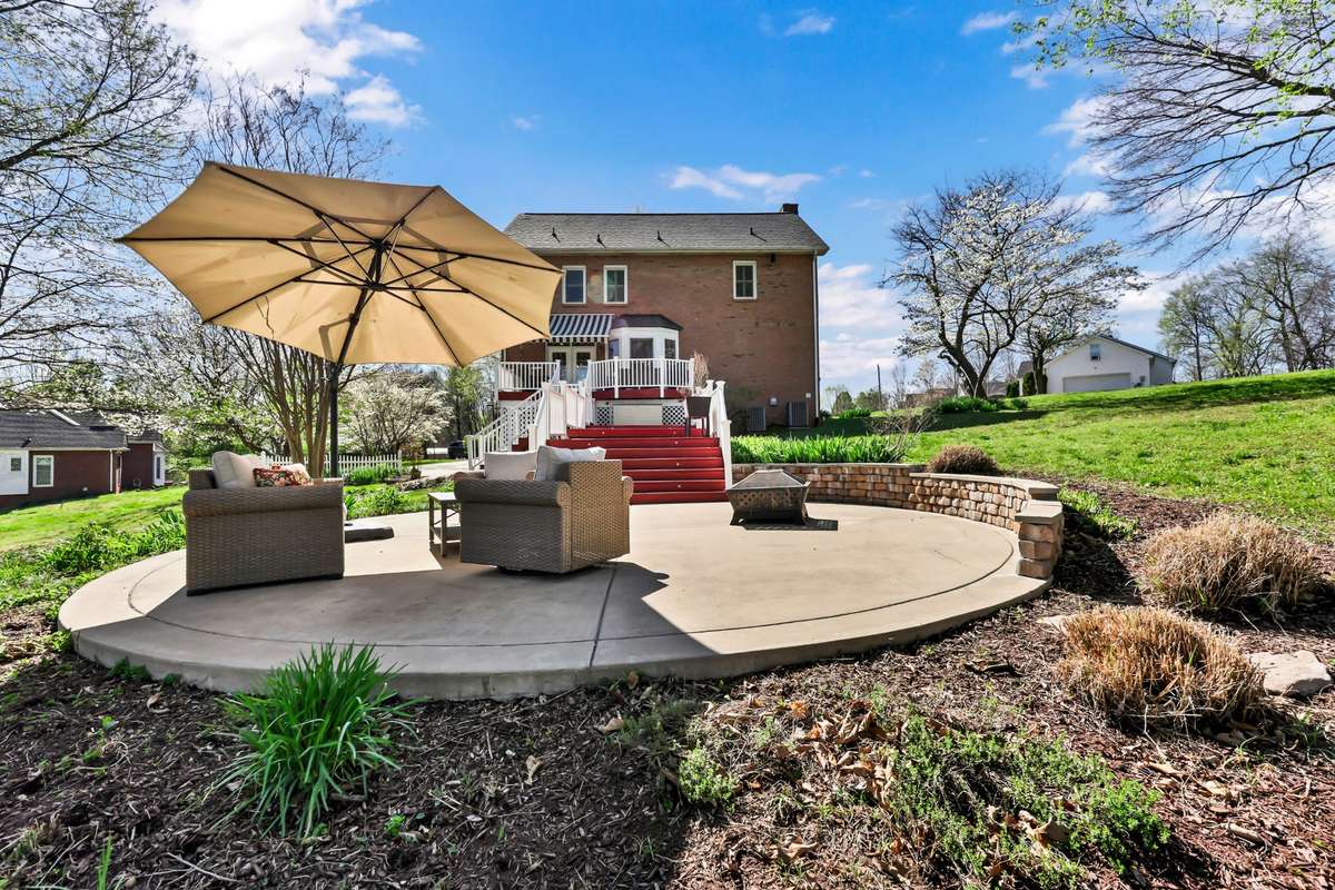The patio area off of the deck is the perfect space for the fire pit