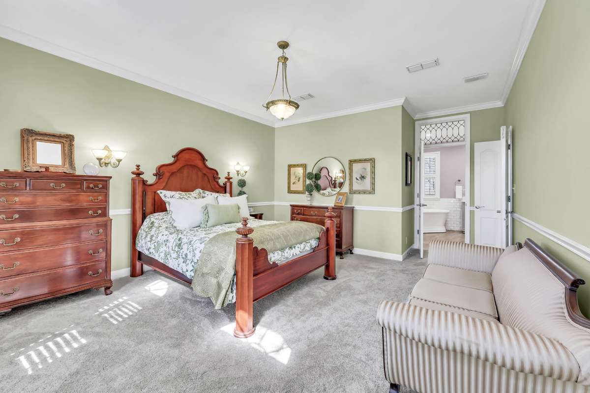 It's all about the details, from the sconce lighting to the glass panel over the primary bath door