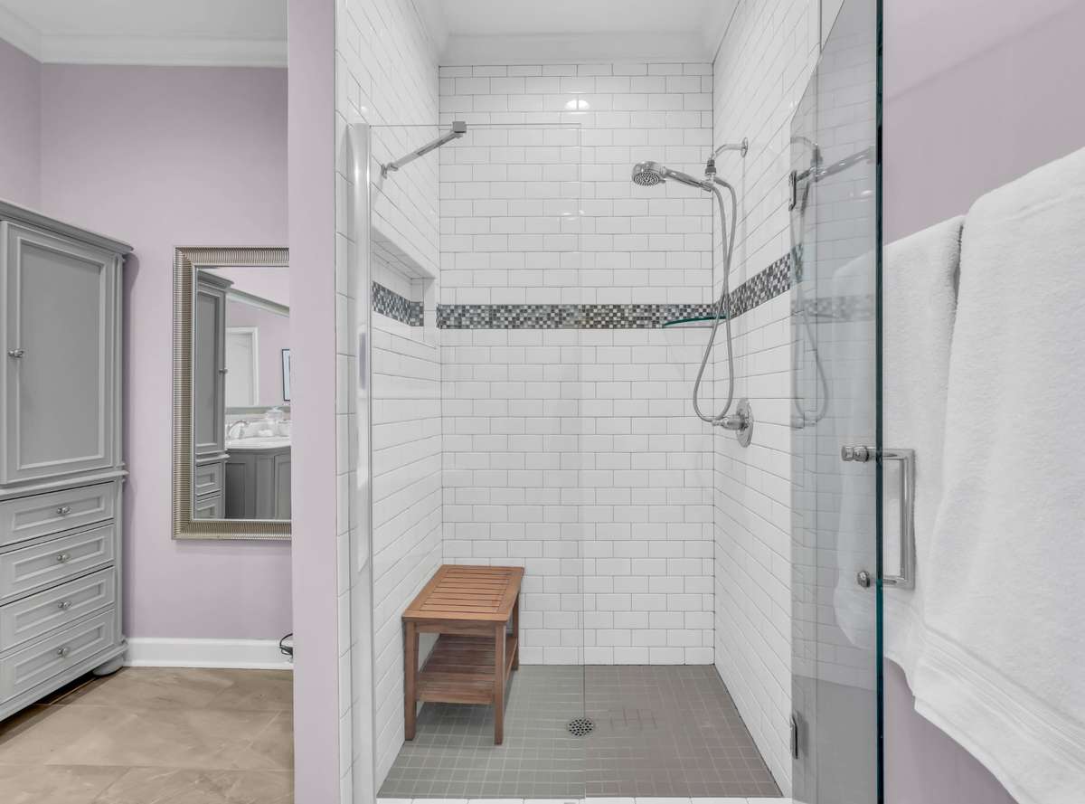 Beautiful walk in tiled showed with glass doors
