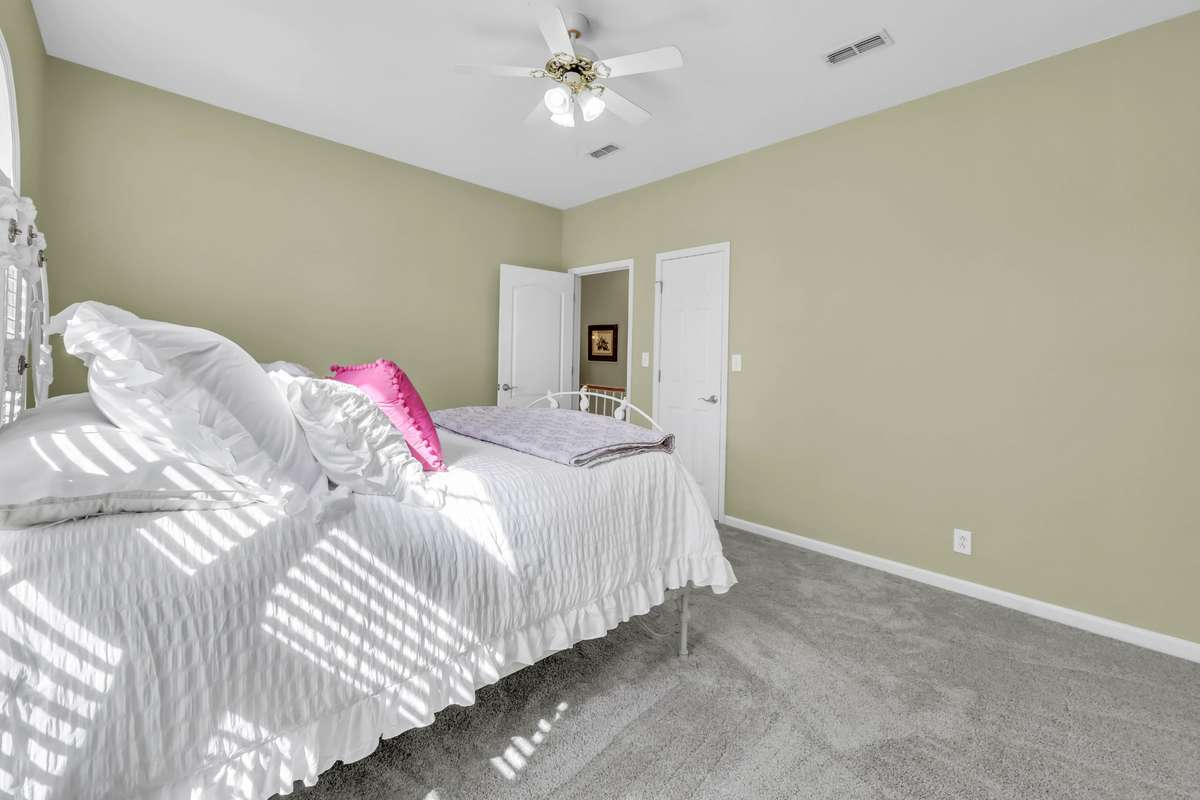 Another view of bedroom 2, which also includes a walk in closet