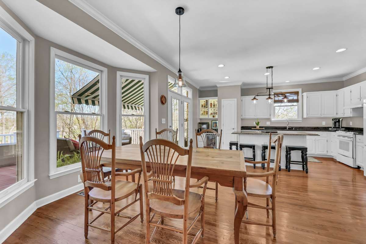 The natural light from the bay window + beautiful hardwood flooring