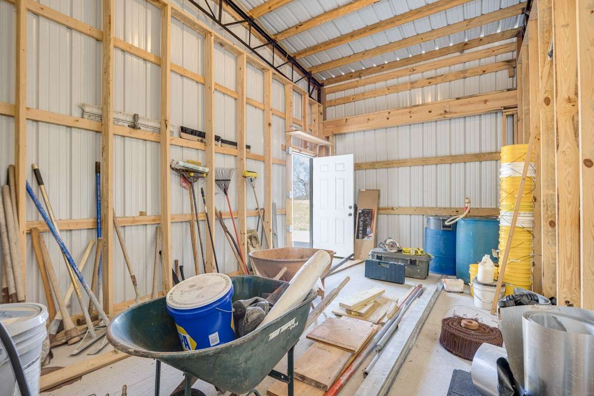 Extra storage room on the Southeast corner of building. Notice that it is framed for a future garage door, if need be.