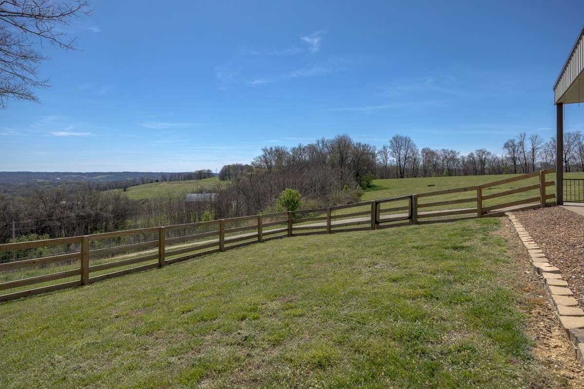1600 Sq ft Fenced in dog run off the front porch