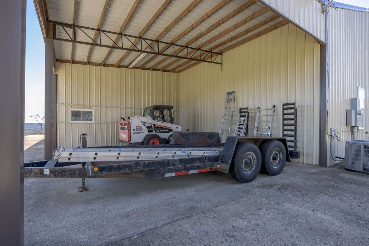 One of two covered attached carports to store toys or equipment