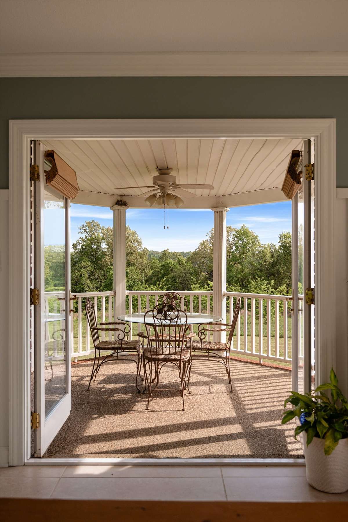 Double french doors leading to your side porch from dining room