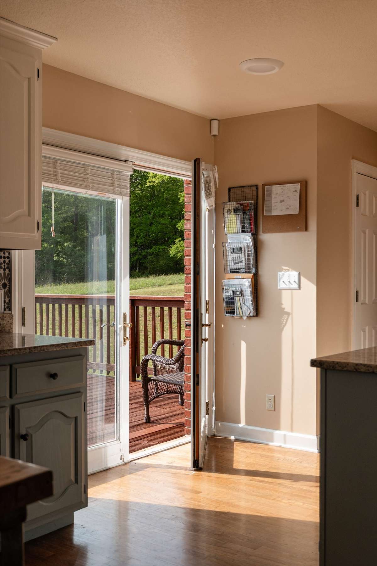 Double french doors to the back deck from the kitchen