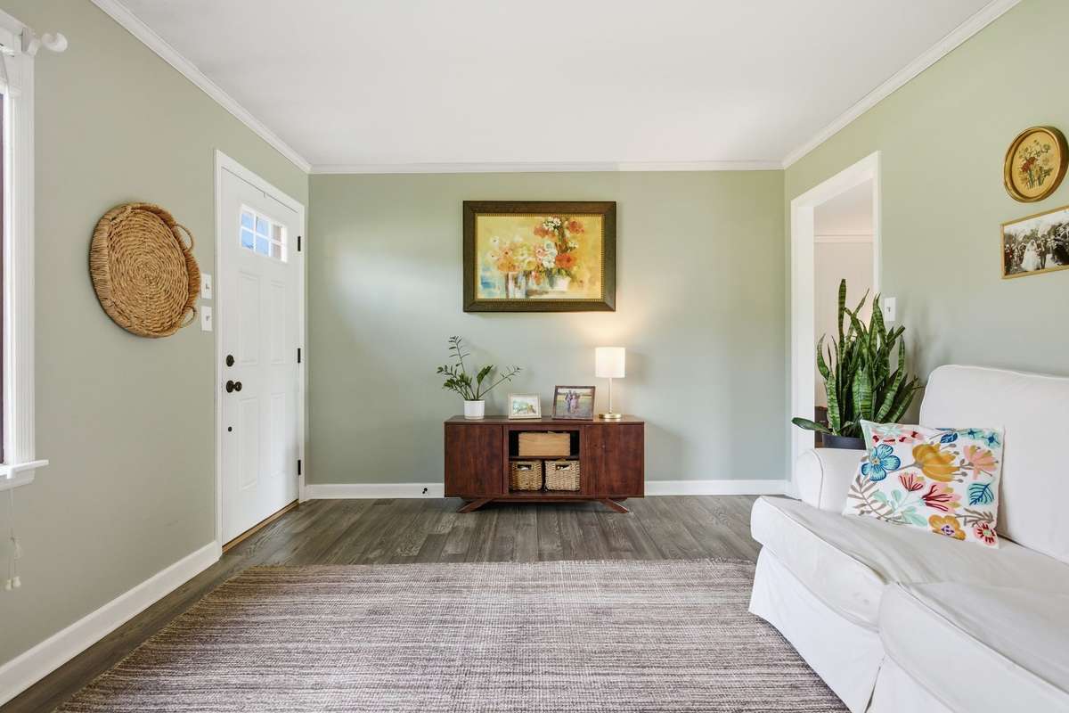 Another view of the living room with access to the kitchen on the right.