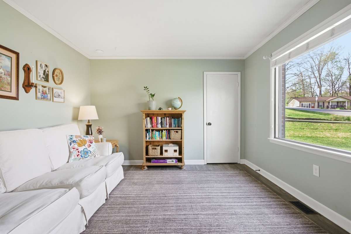 Great picture window lets in tons of natural light. Behind the door you'll find a stackable washer and dryer unit for convenience.