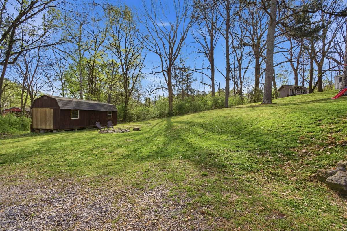 A view of the large back yard. Shed does not convey with the sale of home.