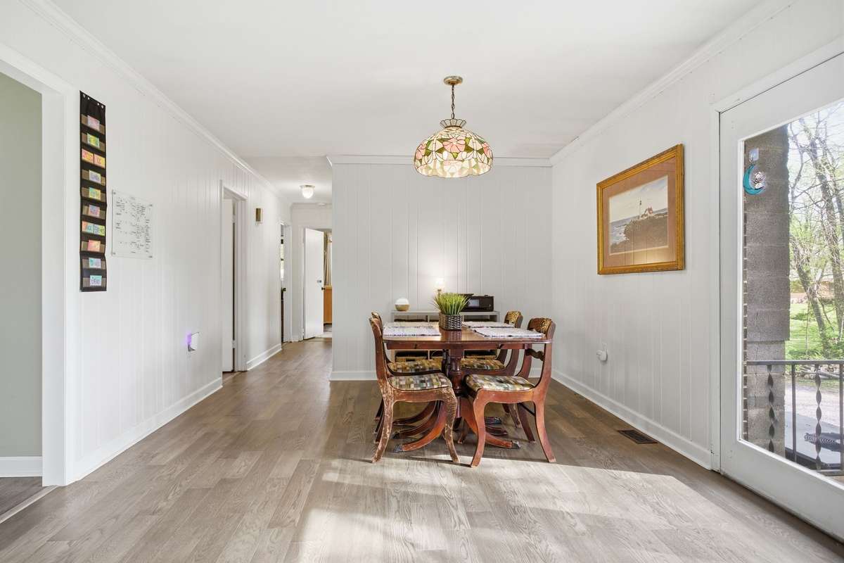 A view of the dining area leading to the bedrooms.