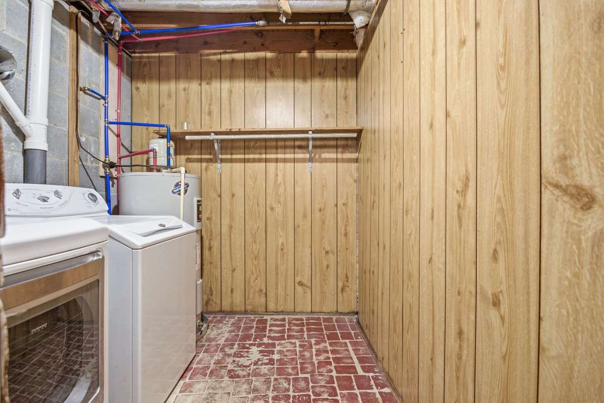 This secondary laundry room is located in the basement.