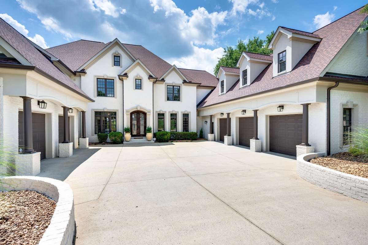 Gorgeous 12,000 SF Estate on quiet cul-de-sac almost acre level lot in private Governor's Club