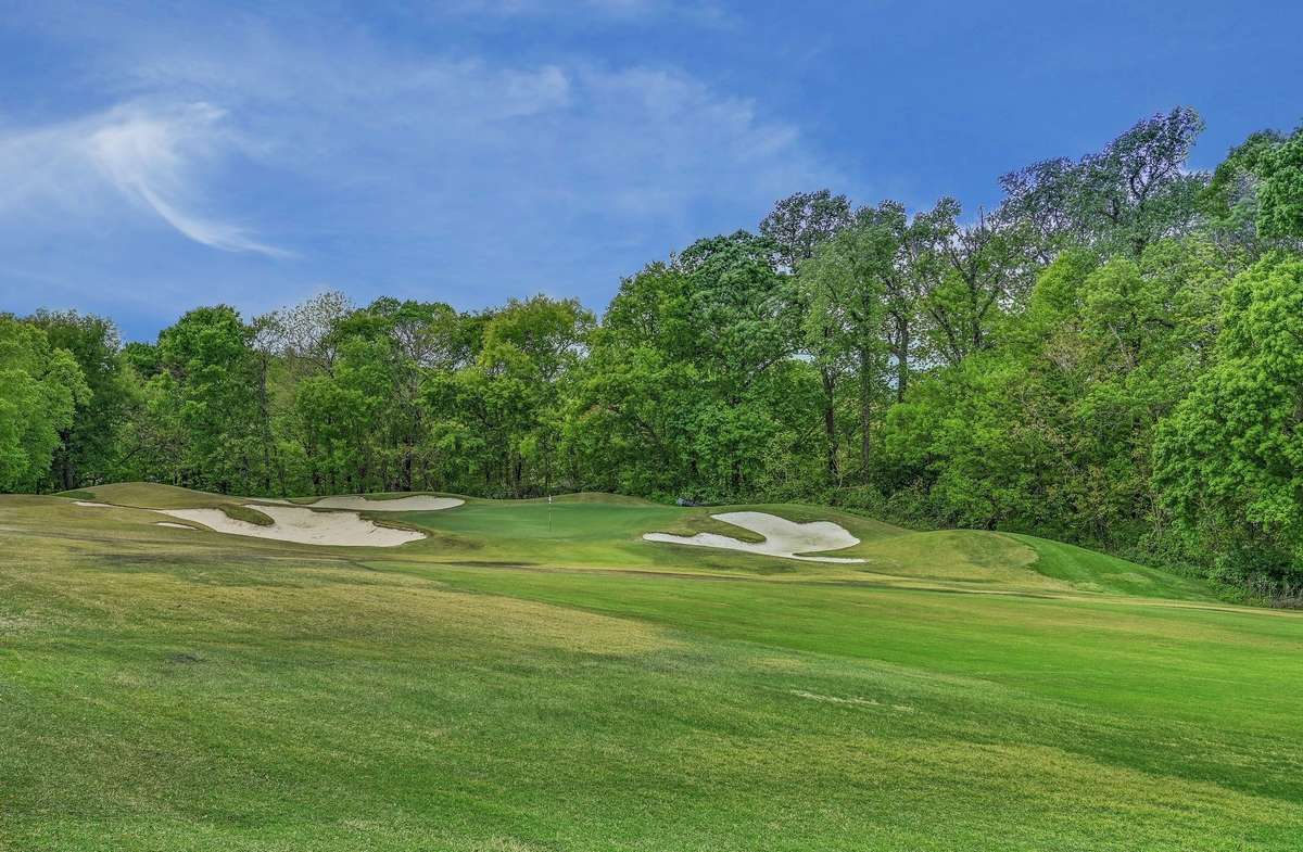 The golf course runs through around the neighborhood