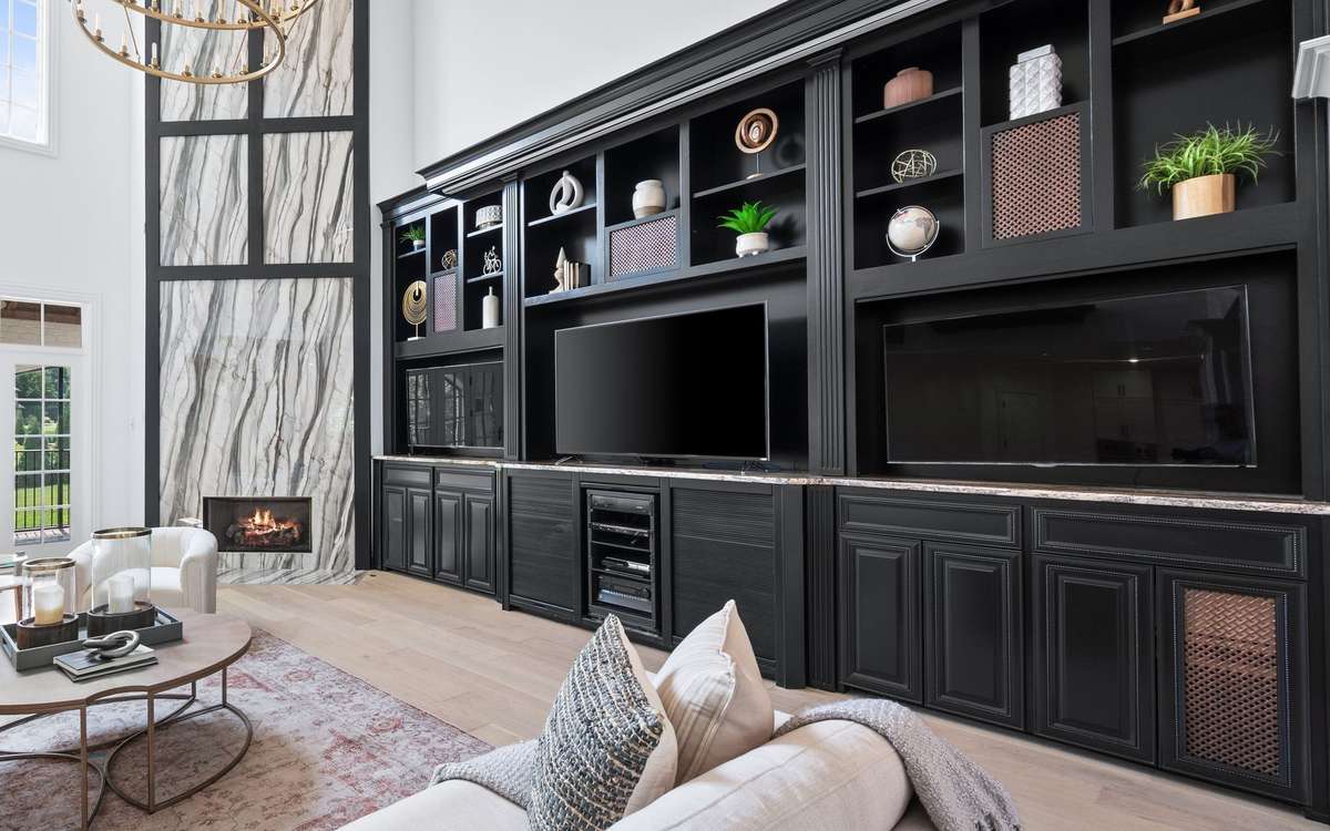 Want to watch a movie?  This built-in hides a screen and components for the main floor theatre. The projector is adjacent  at the top of the wall.