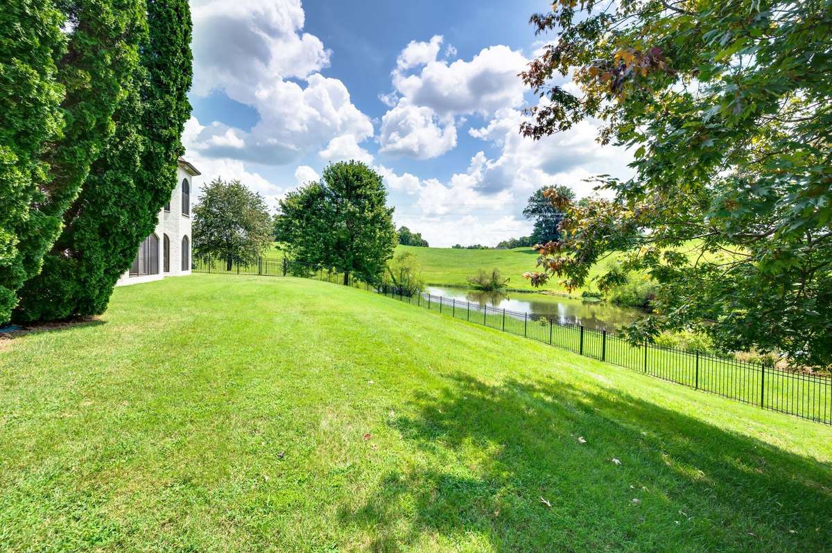 Plenty of room for your canine friends in this fenced backyard.
