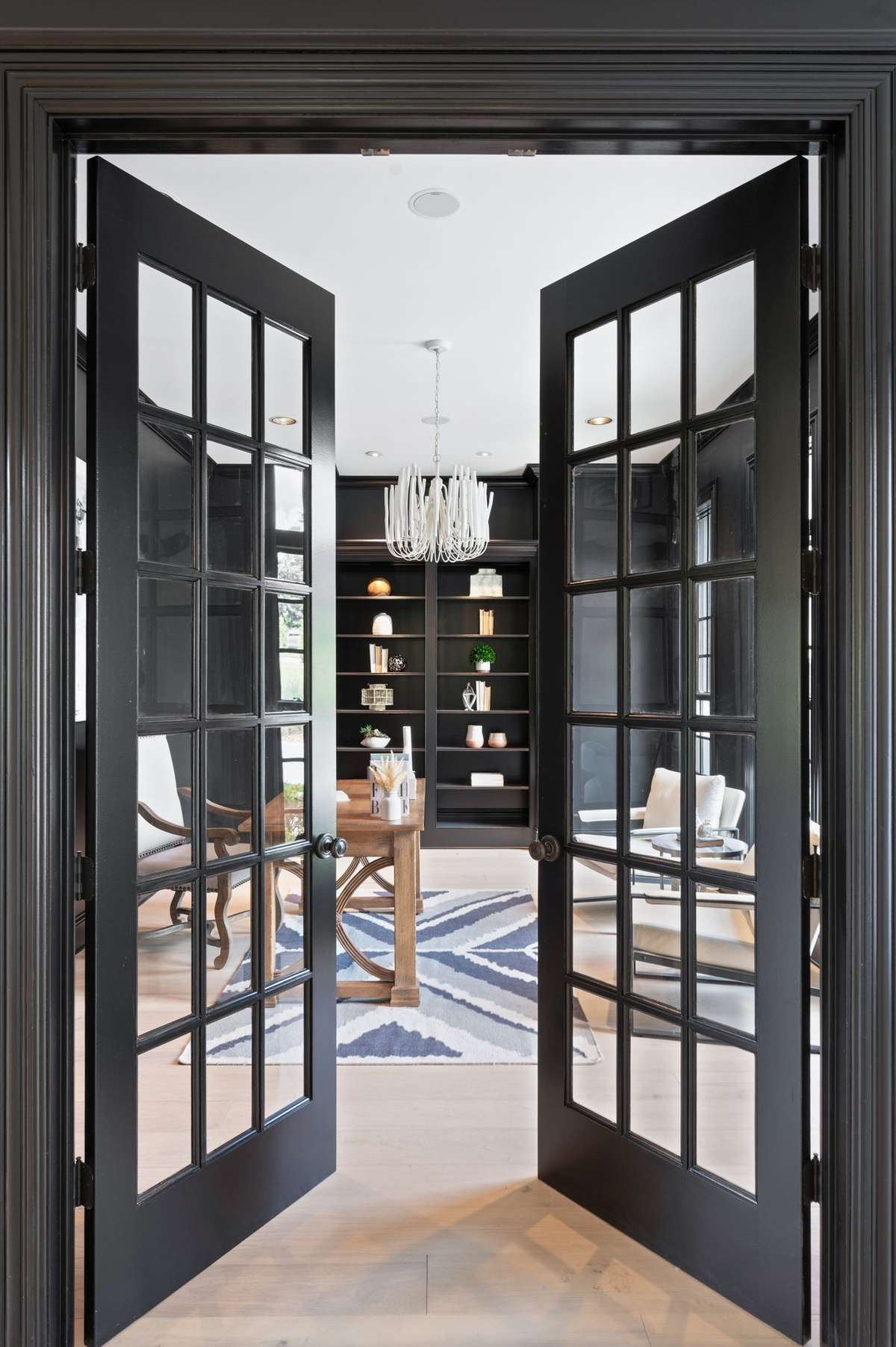 Just off the front foyer is a cozy office/library in a striking hue.