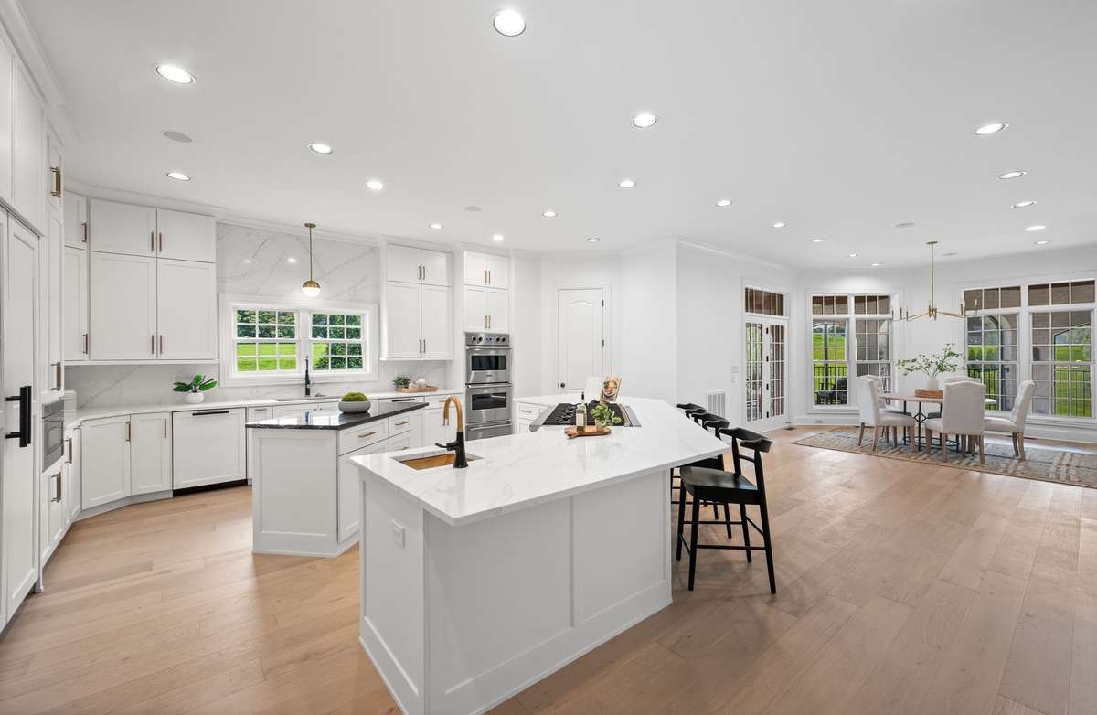 A brand new kitchen!  Two islands, quartz counters, custom cabinets and brand new stainless top of the line appliances.