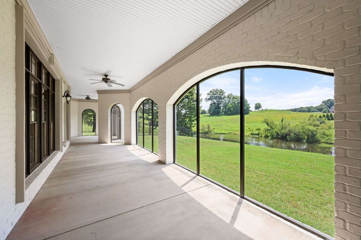 The downstairs terrace level wraparound screened porch is also very impressive.