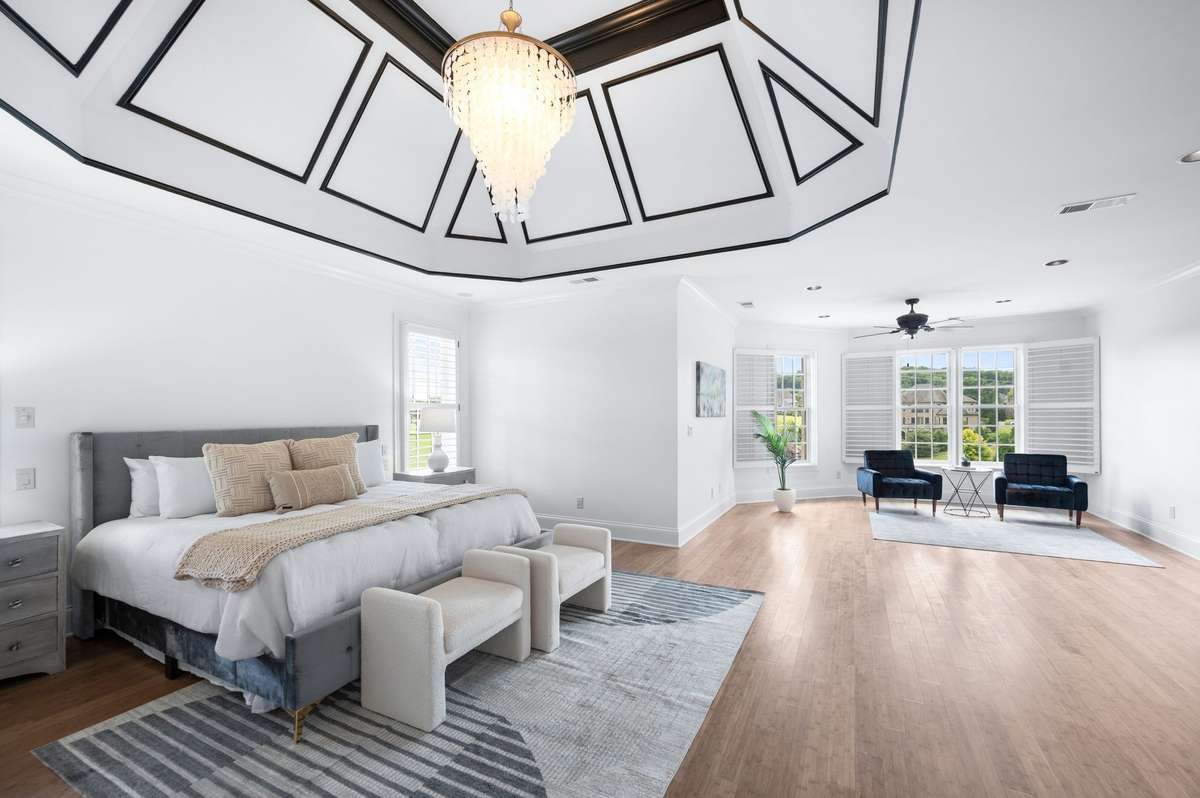 Wow!!!  This bedroom is enormous!  Plenty of room for a large sitting room.