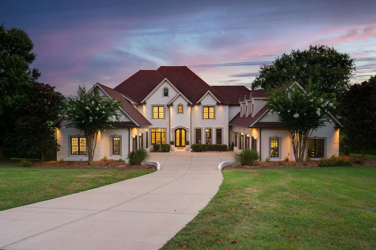 Nestled on a quiet cul-de-sac with almost acre private level lot with nothing behind except a small lake and fountain.