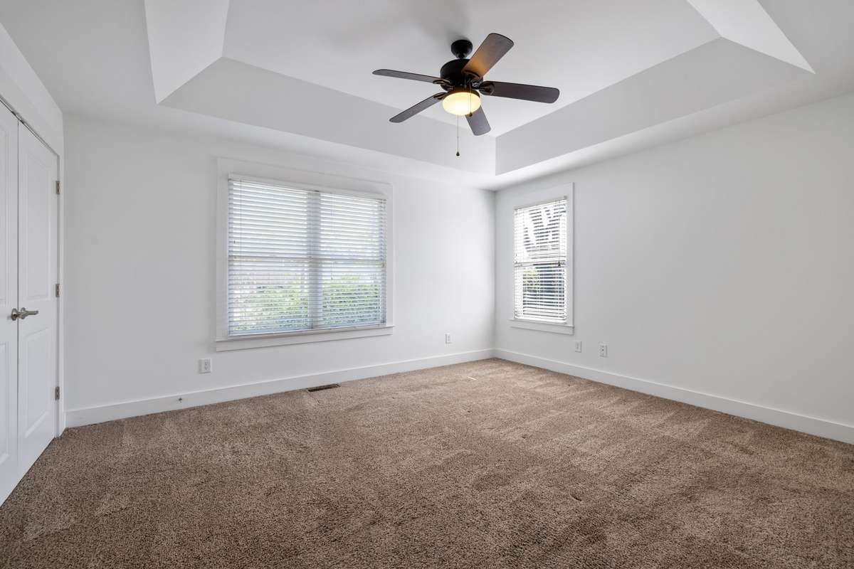 Secondary bedroom is large, filled with light and two spacious closets.