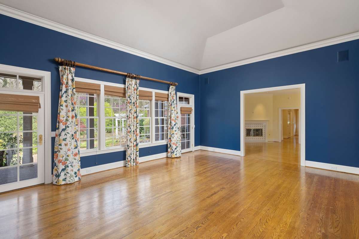 Large family room off of kitchen with abundant light and windows