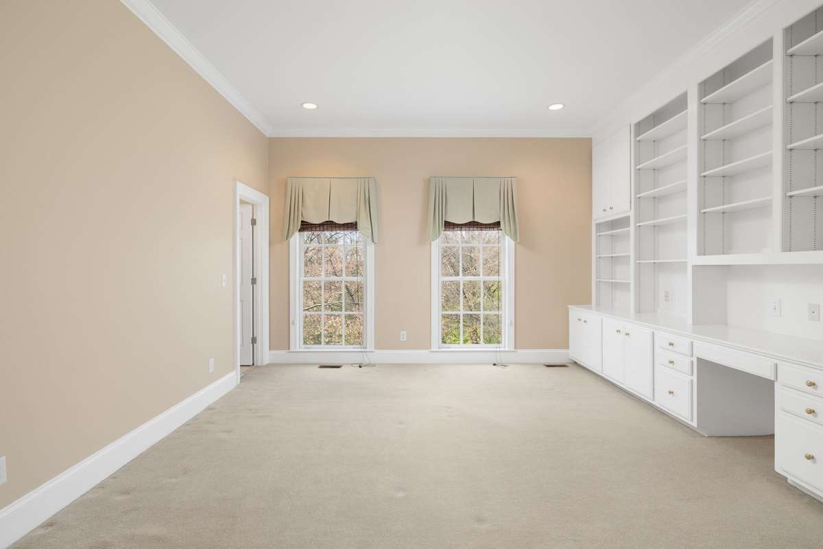 Ensuite bedroom on the main level with built-ins