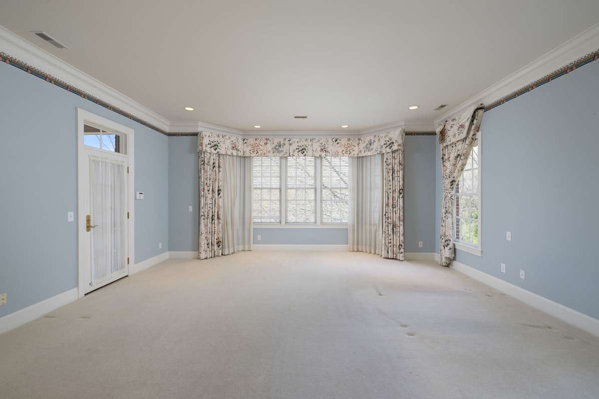 Primary bedroom is convenient to other bedrooms, yet private