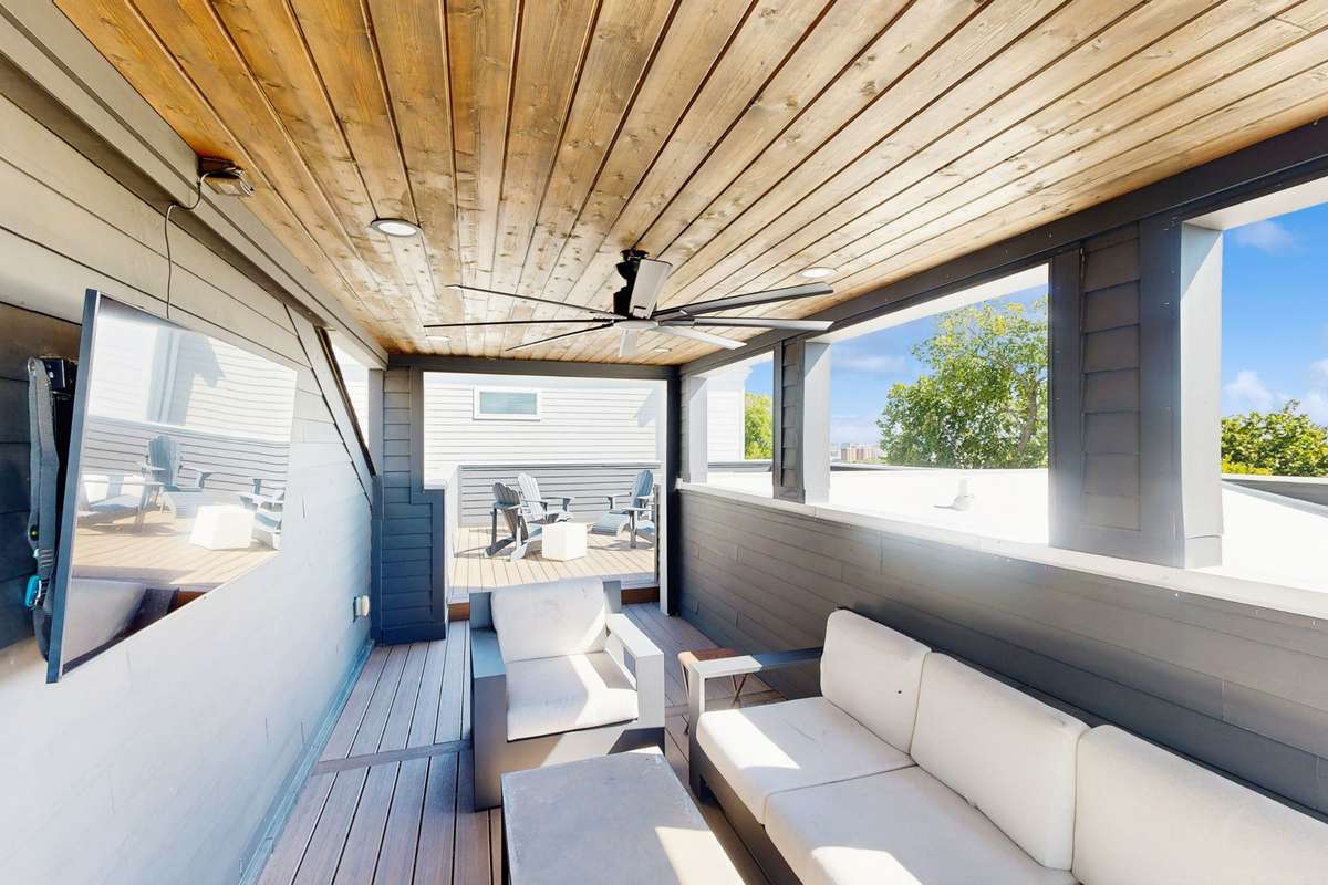 Covered rooftop area perfect for relaxing under the stars or watching Sunday football.