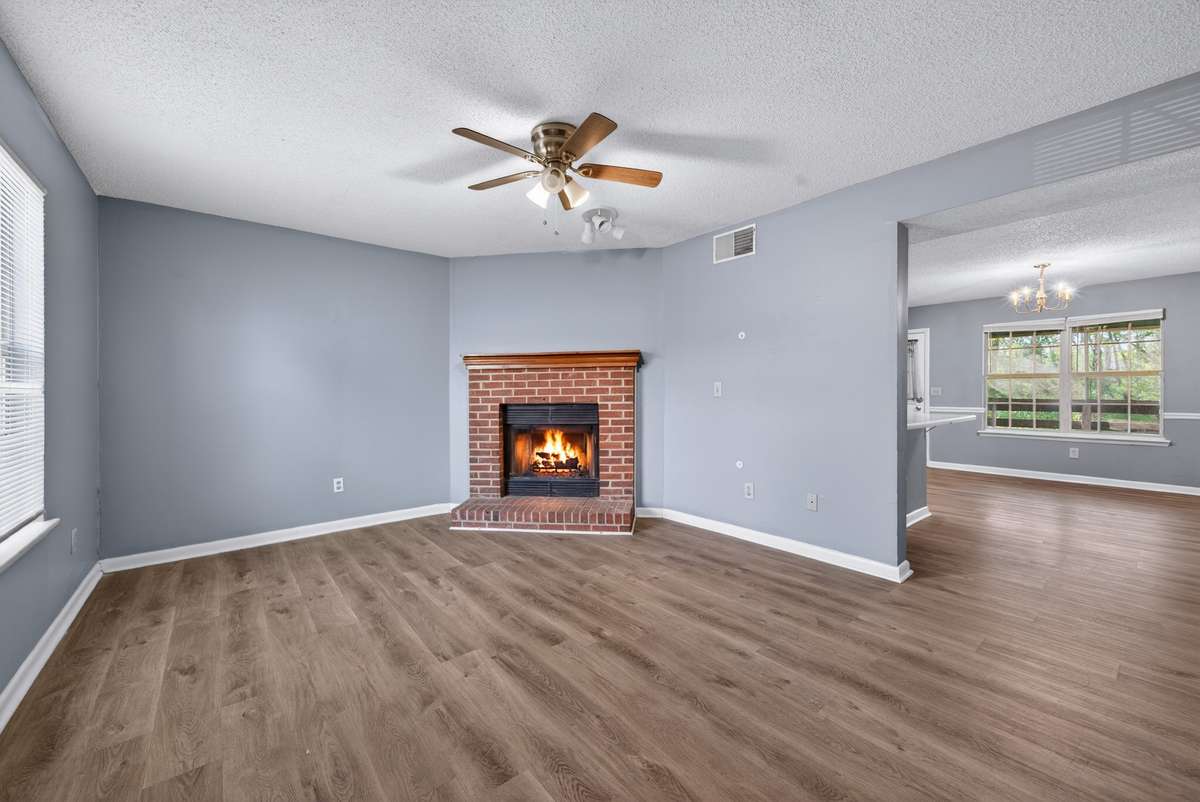 Living Room Capturing a View of Kitchen