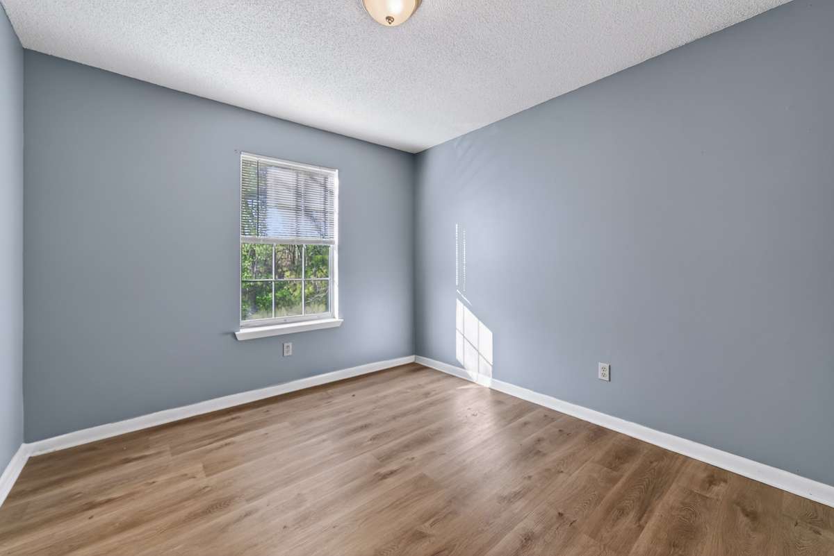 Second bedroom with views of the creek and wooded surroundings