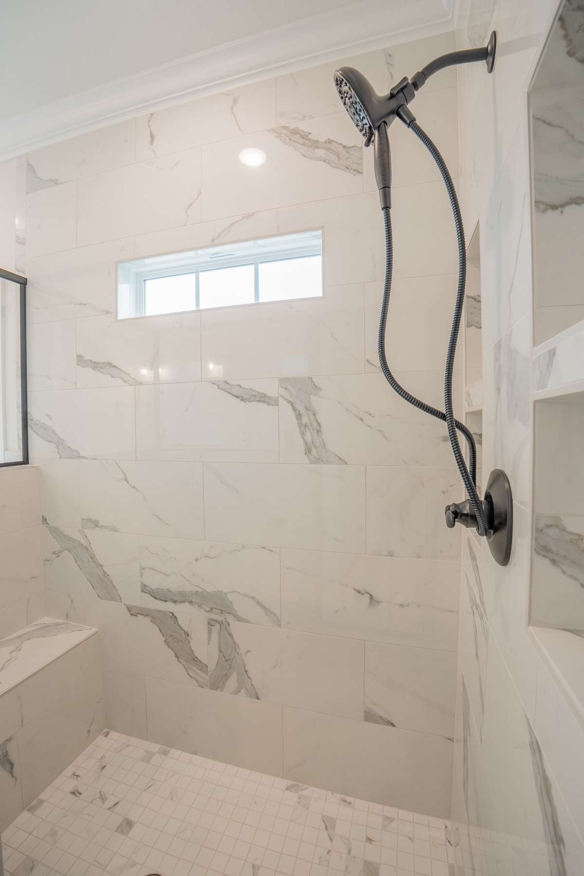 Fully Tiled Shower with a Bench and a Window!