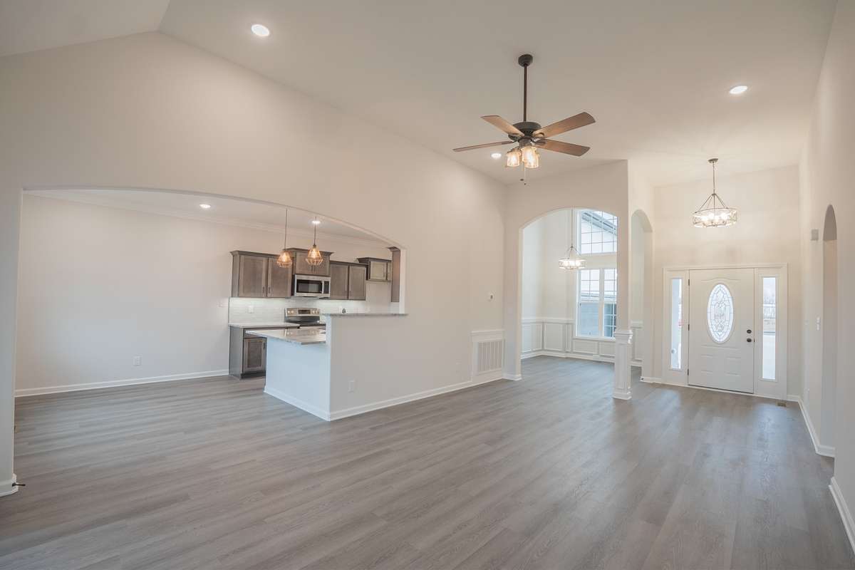 Open Layout Downstairs and SPC Flooring Throughout the Foyer, Living Room, Eat-in Area, Kitchen and Formal Dining Room!