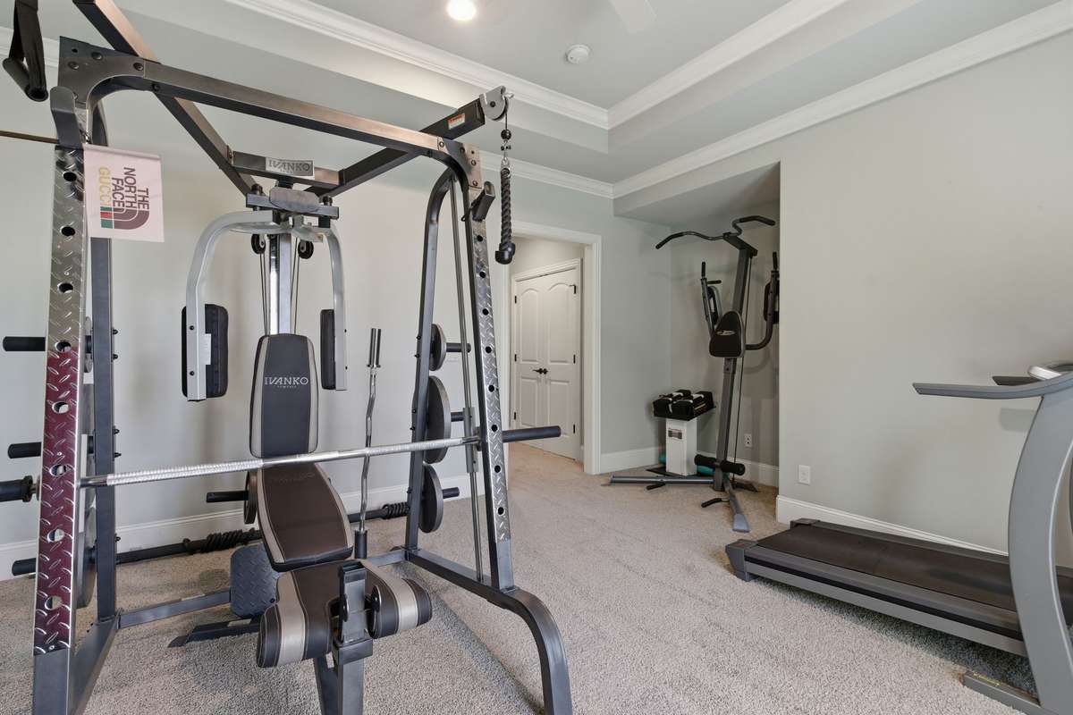 Bedroom #5 this is currently being used as a home gym. It also has its own en-suite and balcony.