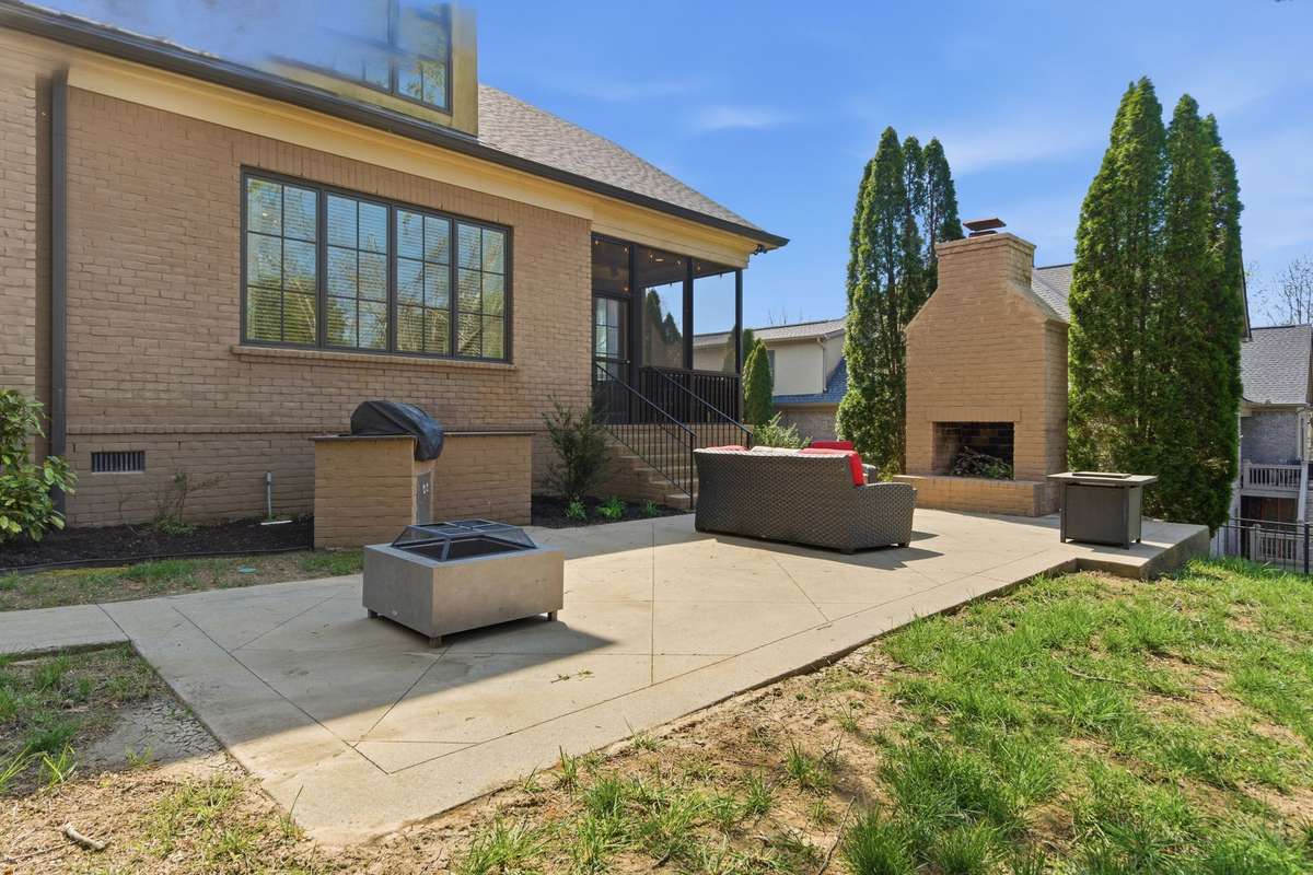 Backyard patio area. It features an outside fireplace and built-in Grill perfect spot for entertaining.