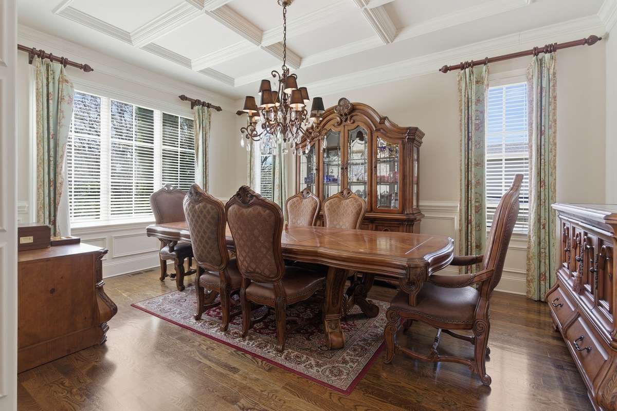 Extended formal dining room with detailed trimming and Crawford ceiling.