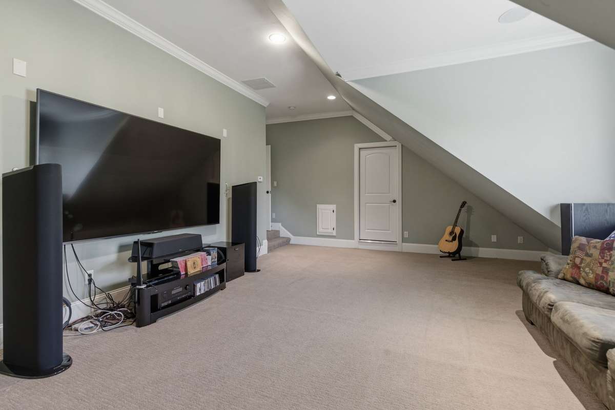 Bonus room with access to walk-in attic storage.