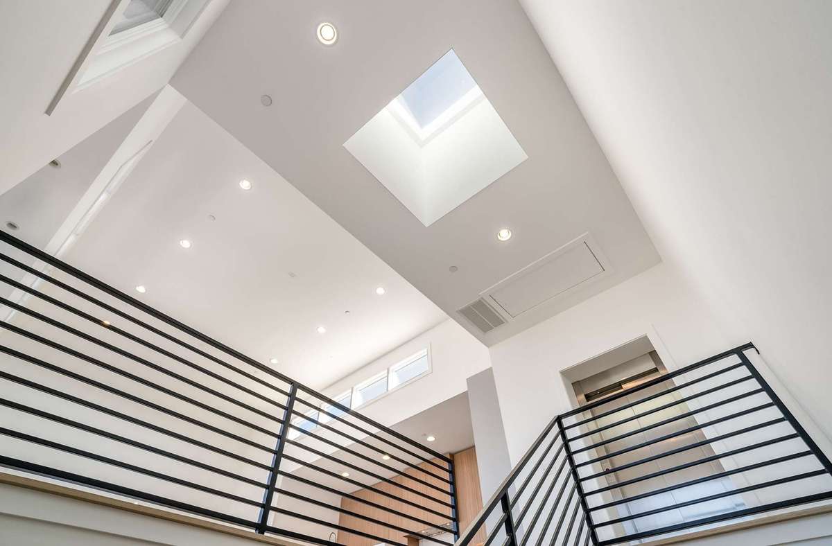 Skylight at the top of the stairs cascades light all the way down the stairs