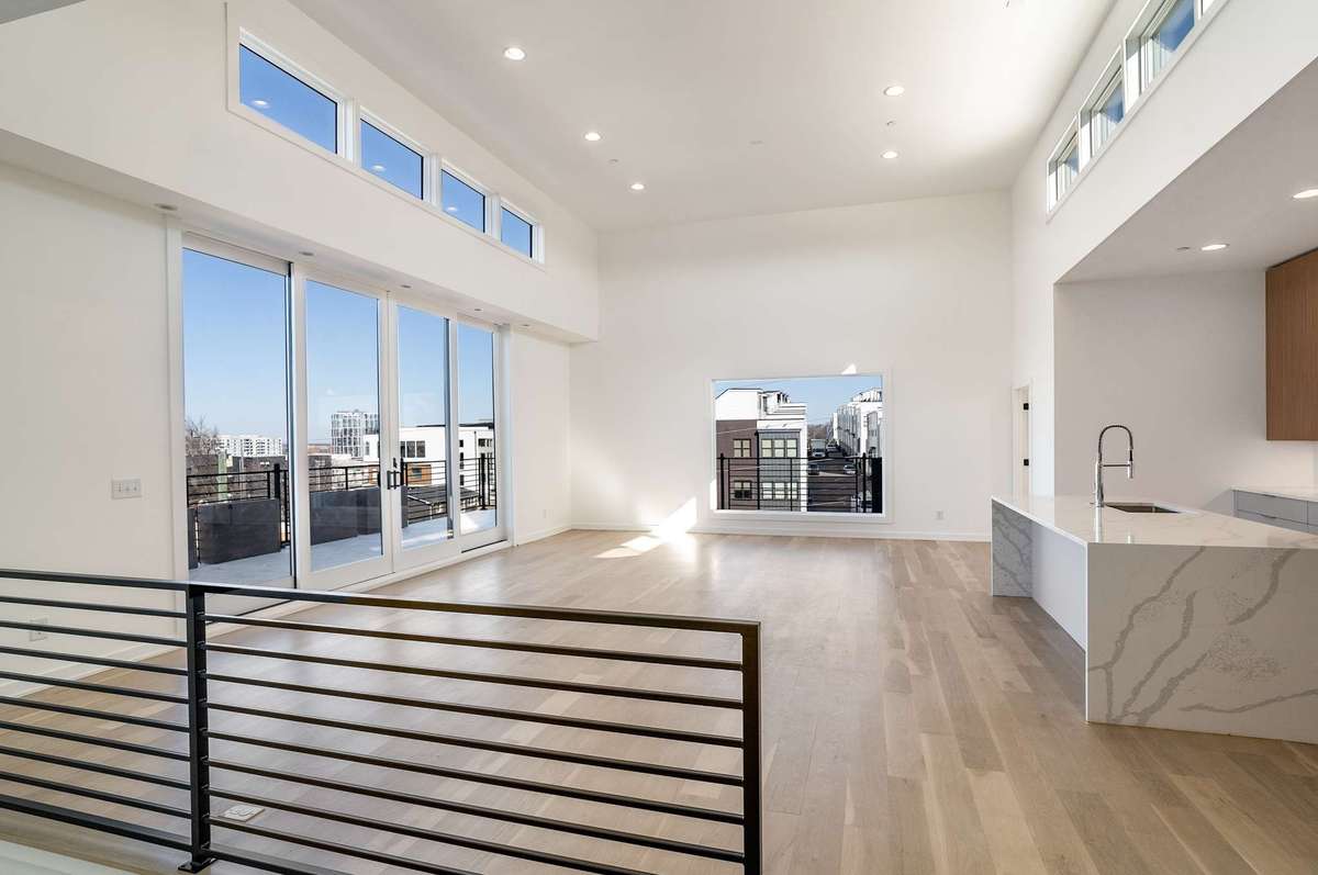 Main floor living / kitchen / dining offering 270 degree condo penthouse views