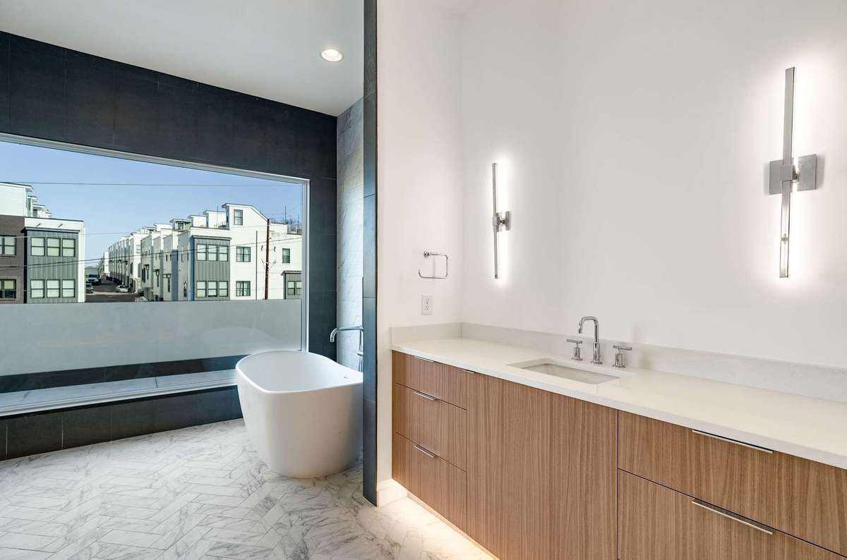 Herringbone tile and soaking tub