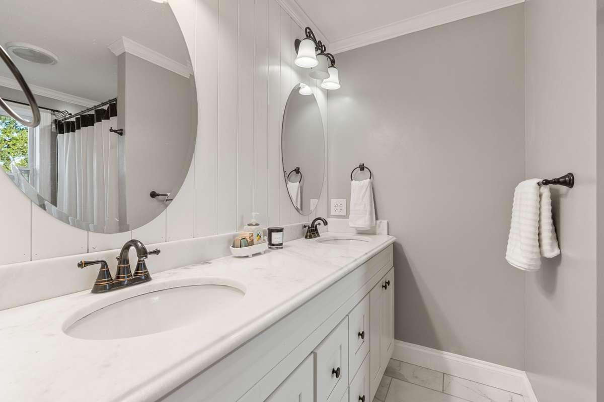 Large secondary bathroom upstairs with double vanity.