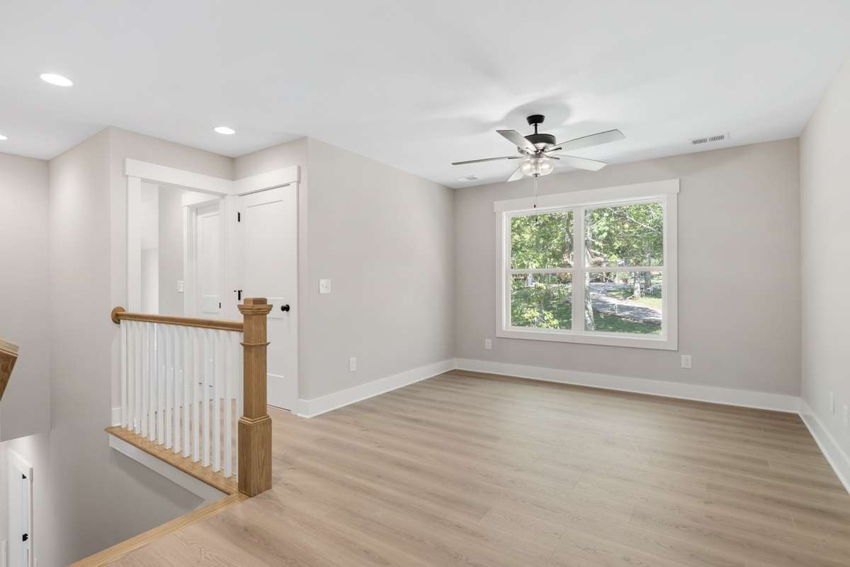 On the second level, you will find a second gathering spot with a view of the backyard.
