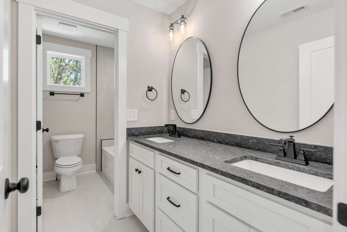 The full bath on the second floor.  The added door gives great functionality to this bathroom.