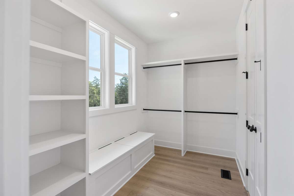 Now that's a closet!  Even built-in storage/bench and . . .