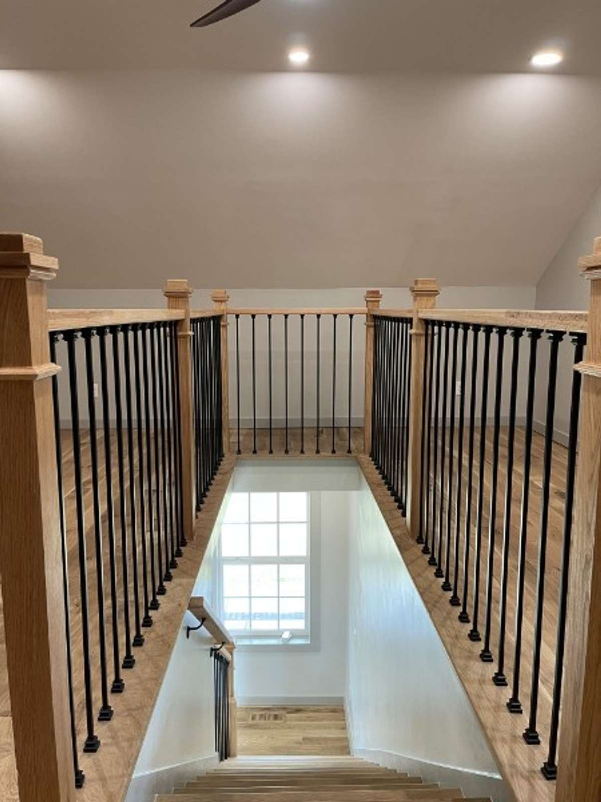 Oak Posts and Rails and Black Spindles to stairwell . . .