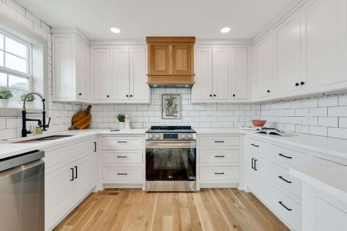 Gorgeous Very CUSTOMIZED Kitchen with Custom Cabinetry, HOOD VENT to outside, Tiled Backsplash to Ceiling and Upgraded Appliances!