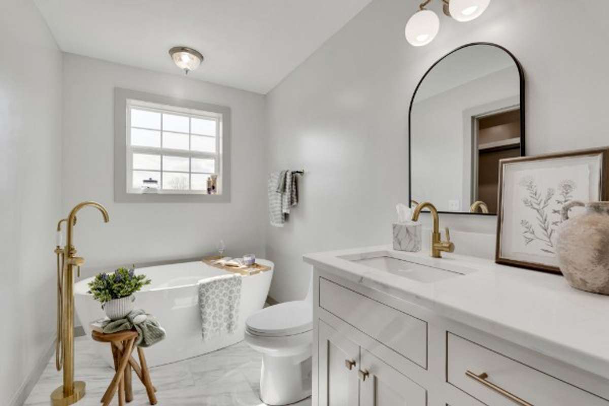 Primary Bath:  Luxury Spa Bath with beautiful, deep stand-alone tub; lovely, large white tile floors, Dual Sink Vanity . . .