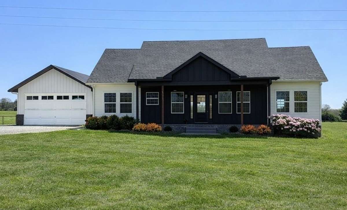 Welcome to 156 Collins River Dr in ROCK ISLAND, running along the COLLINS RIVER!  Featuring a BRAND NEW Oversized Garage/Workshop!